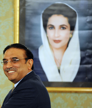 file photo of president zardari in front of benazir bhutto 039 s portrait photo express file