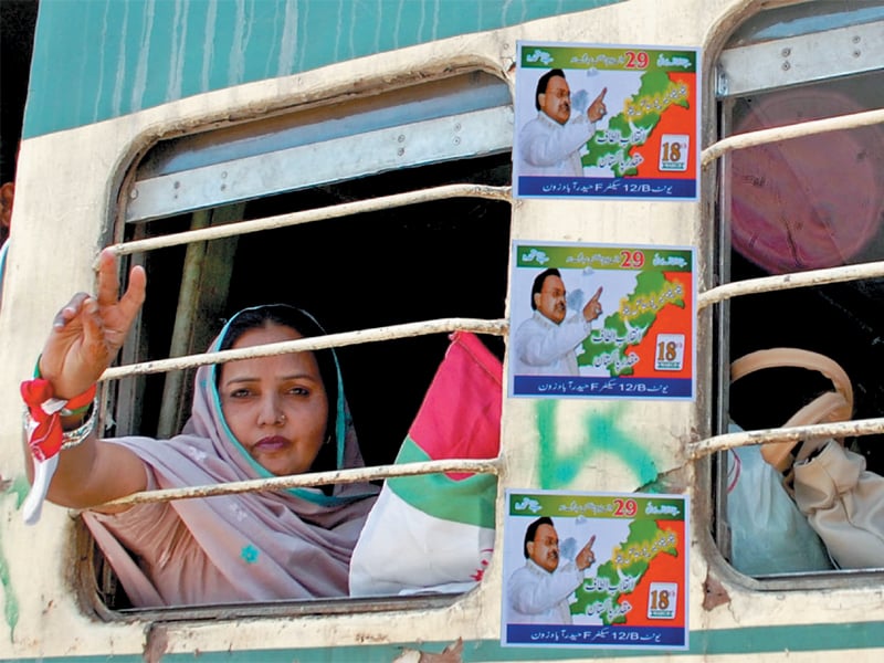 a woman sitting on a train from hyderabad to mirpurkhas where mqm s rally was being held photo express