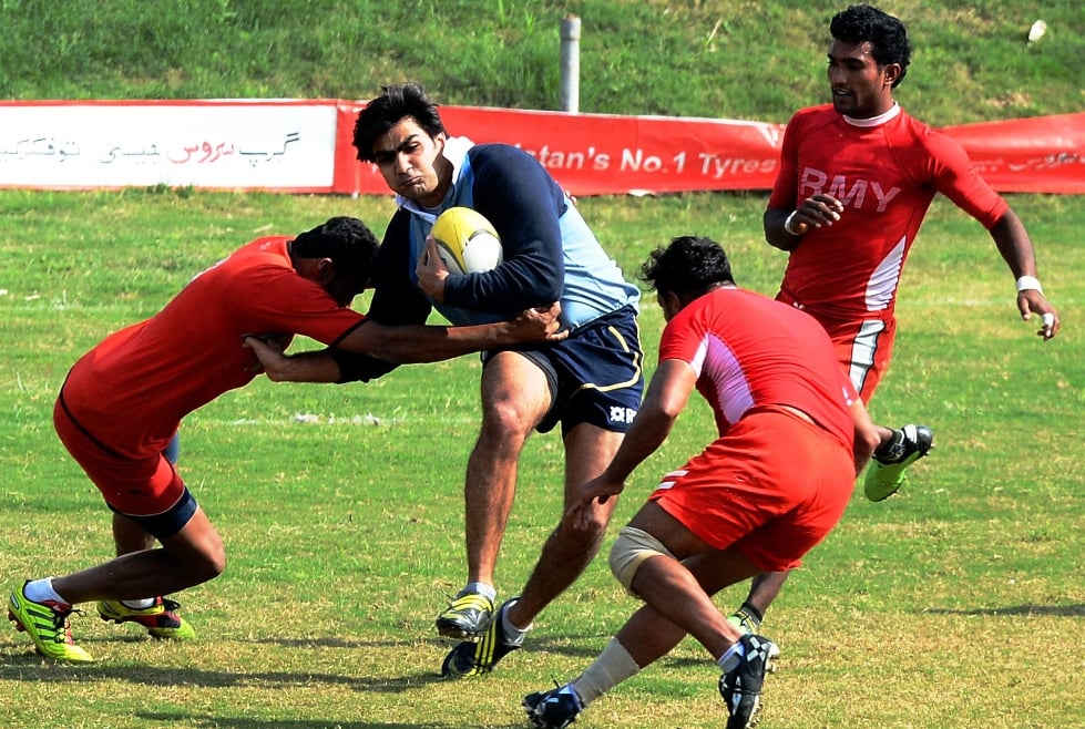 rugby players fight for the ball during a match between the army and team lahore photo afp