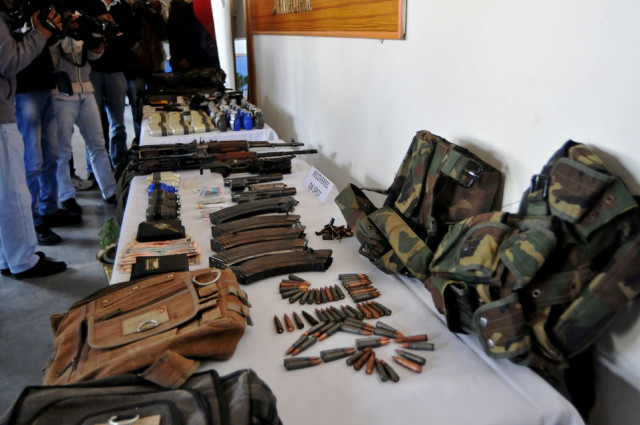 recovered weapons and ammunition which police say were seized following the arrests of suspects linked to an attack against five paramilitary policemen last week are displayed to journalists during a press conference in srinagar on march 19 2013 photo afp recovered weapons and ammunition which police say were seized following the arrests of suspects linked to an attack against five paramilitary policemen last week are displayed to journalists during a press conference in srinagar on march 19 2013 photo afp