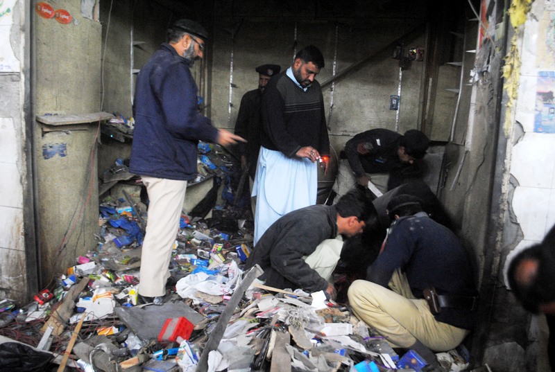 police carry out investigations after a bomb blast in peshawar photo muhammad iqbal express
