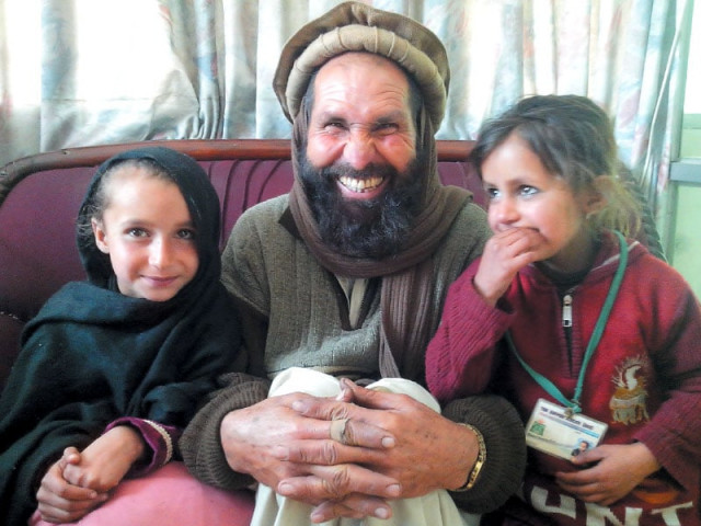 gohar s daughters nazma and sawera with their grandfather muhammad ayoub photo fazal khaliq express