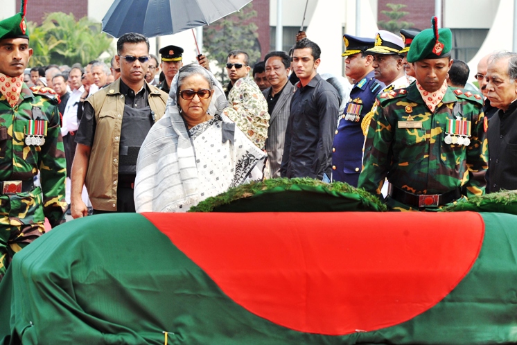 bangladesh prime minister sheikh hasina wajid 3l pays her respects to the body of president zillur rahman at hazrat shahjalal international airport in dhaka on march 21 2013 photo afp