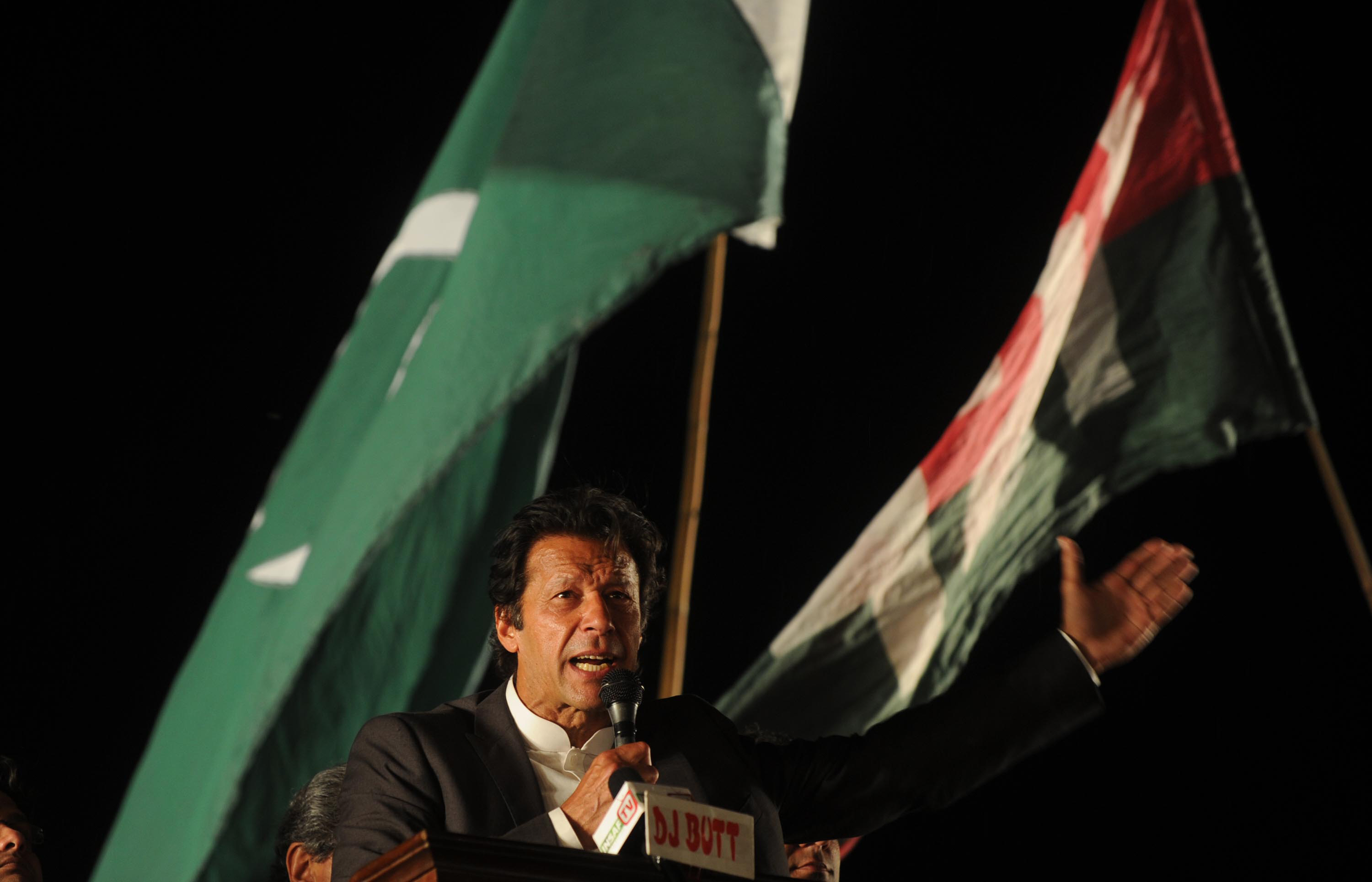 chairman pakistan tehreek e insaf imran khan gestures as he addressing a public meeting in lahore on march 23 2013 photo afp