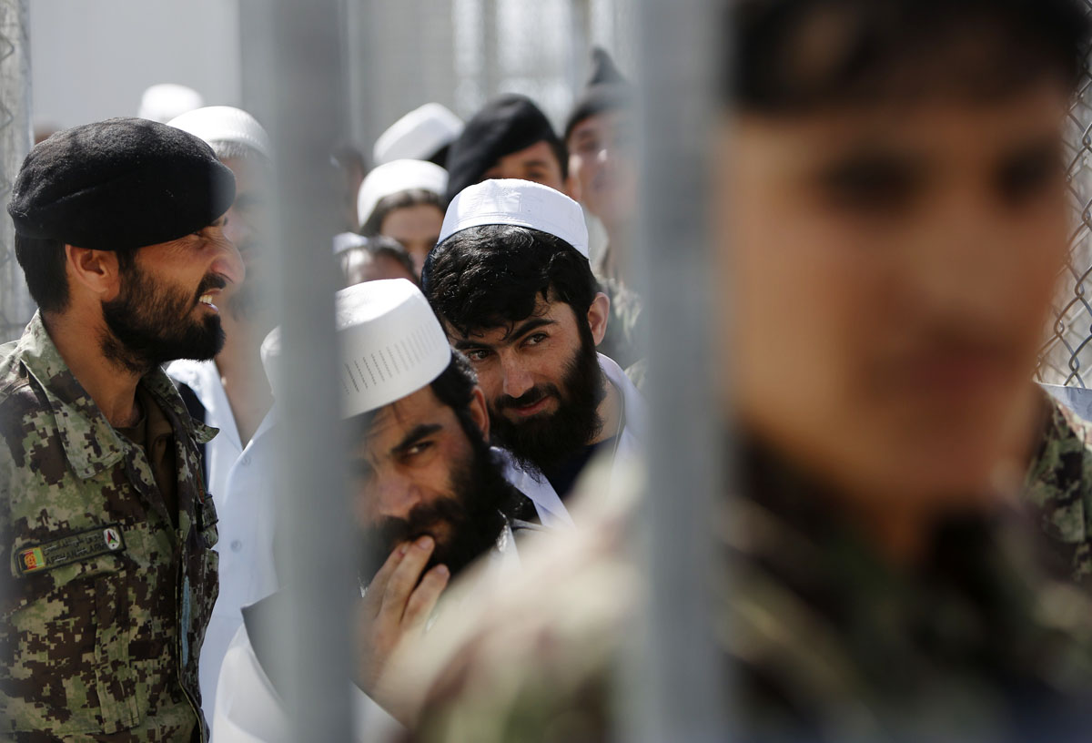 prisoners stand in line for their release during a ceremony handing over the bagram prison to afghan authorities photo reuters