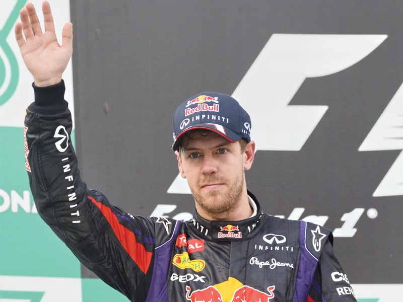 vettel ignored team orders to snatch victory from team mate webber in malaysia photo afp