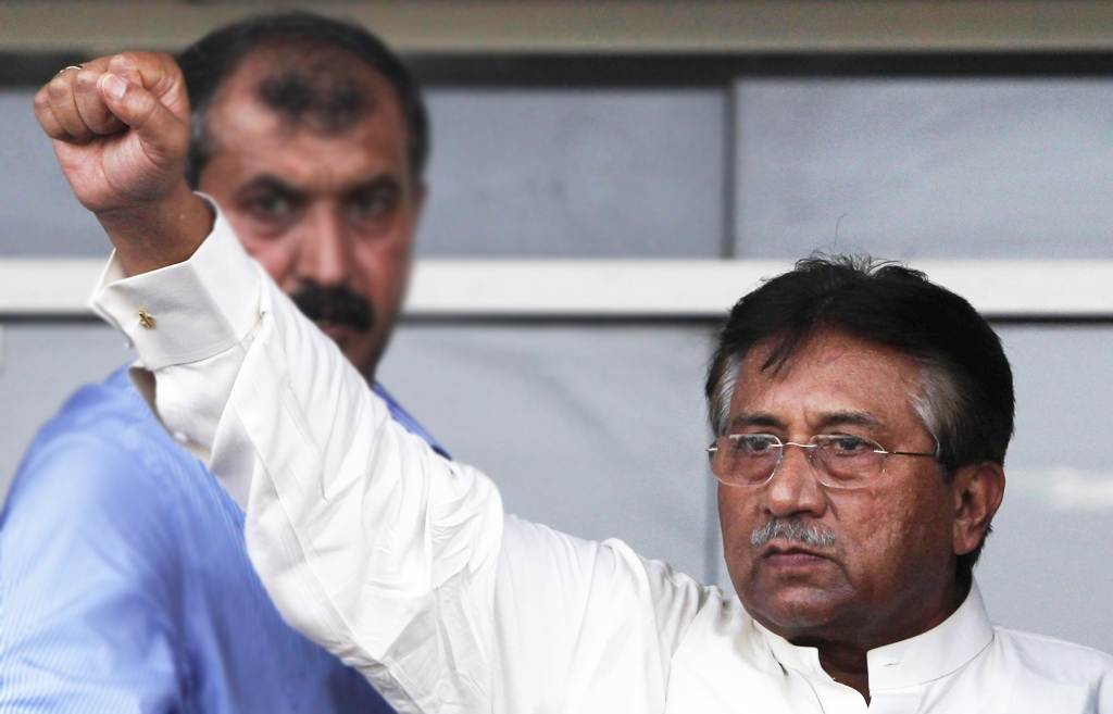 former president pervez musharraf gestures to his supporters upon his arrival from dubai at jinnah international airport in karachi march 24 2013 photo reuters