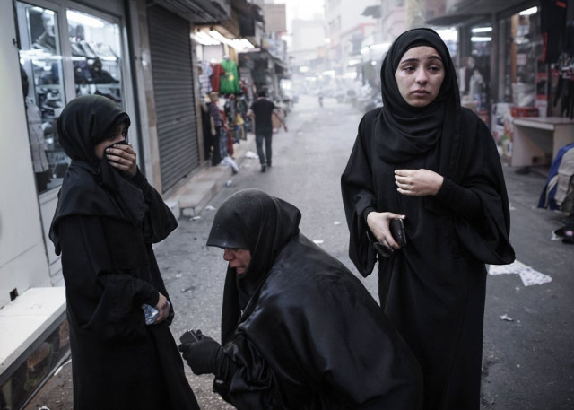 bahraini women react after inhaling tear gas fired by riot police during an anti regime rally on march 29 2013 photo afp bahraini women react after inhaling tear gas fired by riot police during an anti regime rally on march 29 2013 photo afp