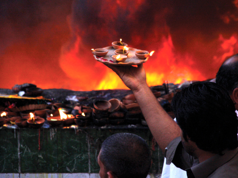a man holds earthen lamps photo abid nawaz express