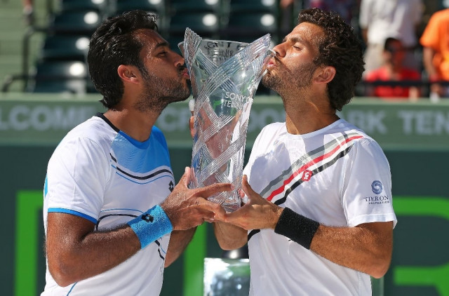 aisamul haq qureshi of pakistan and jean julien rojer of the netherlands pose with the trophy after winning the doubles final against mariusz fyrstenberg and marcin matkowski of poland during the sony open at crandon park tennis center on march 30 2013 in key biscayne florida photo afp aisamul haq qureshi of pakistan and jean julien rojer of the netherlands pose with the trophy after winning the doubles final against mariusz fyrstenberg and marcin matkowski of poland during the sony open at crandon park tennis center on march 30 2013 in key biscayne florida photo afp