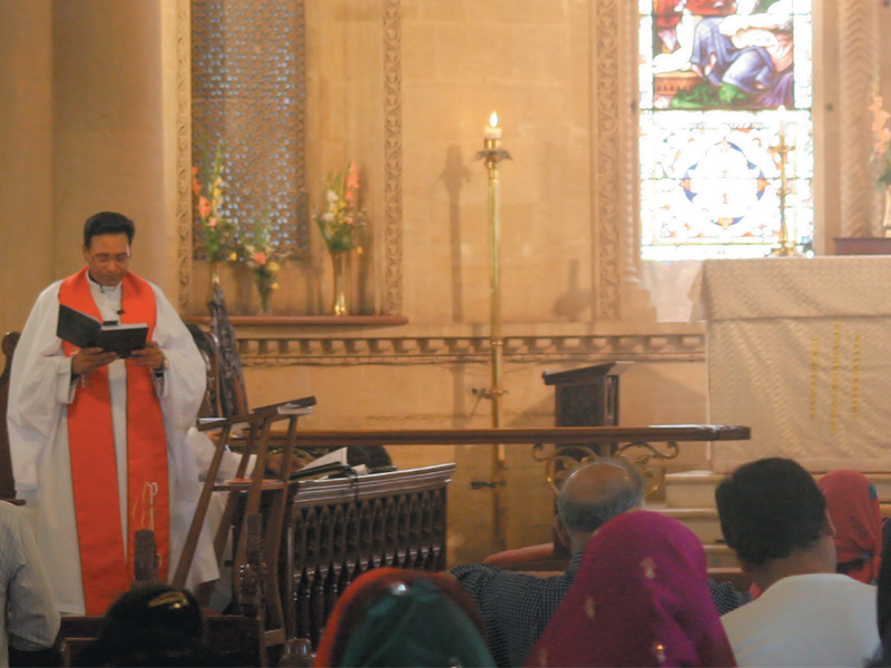 people listen to prayers at a communion service in urdu at the holy trinity cathedral photo athar khan express