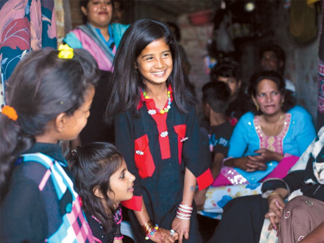little areeba smiles while talking to a relative left while joshua is fascinated by a parrot perched on a stick right photo myra iqbal little areeba smiles while talking to a relative left while joshua is fascinated by a parrot perched on a stick right photo myra iqbal