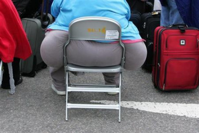 obese airline passengers should pay extra economist says