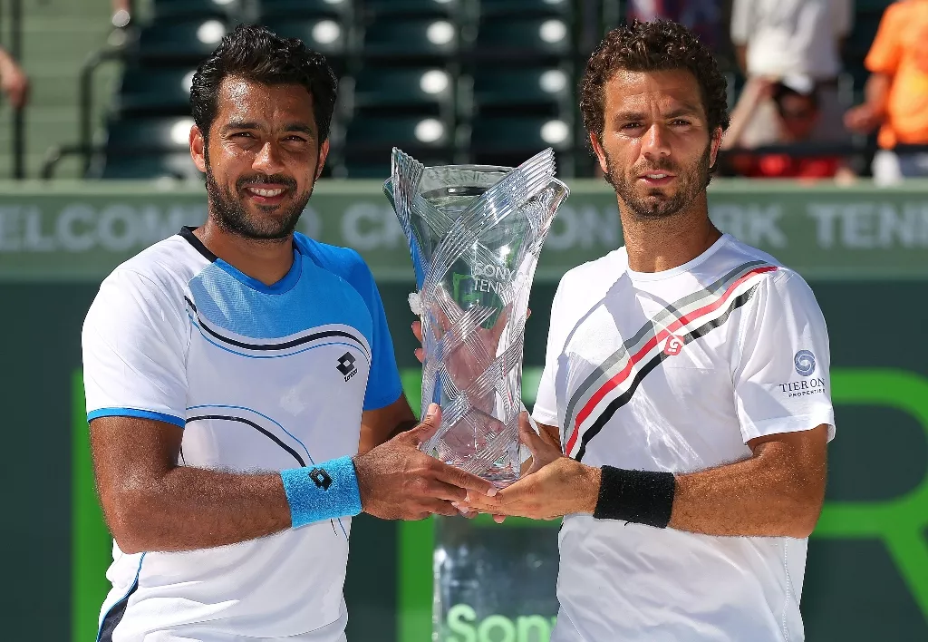 aisamul haq qureshi of pakistan and jean julien rojer of the netherlands pose with the trophy after winning the doubles final against mariusz fyrstenberg and marcin matkowski of poland during the sony open at crandon park tennis center on march 30 2013 in key biscayne florida photo afp aisamul haq qureshi of pakistan and jean julien rojer of the netherlands pose with the trophy after winning the doubles final against mariusz fyrstenberg and marcin matkowski of poland during the sony open at crandon park tennis center on march 30 2013 in key biscayne florida photo afp
