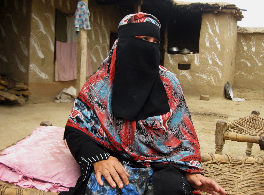 badam zari 55 a candidate for upcoming general elections looks on while speaking to potential voters during her campaign in khar photo afp