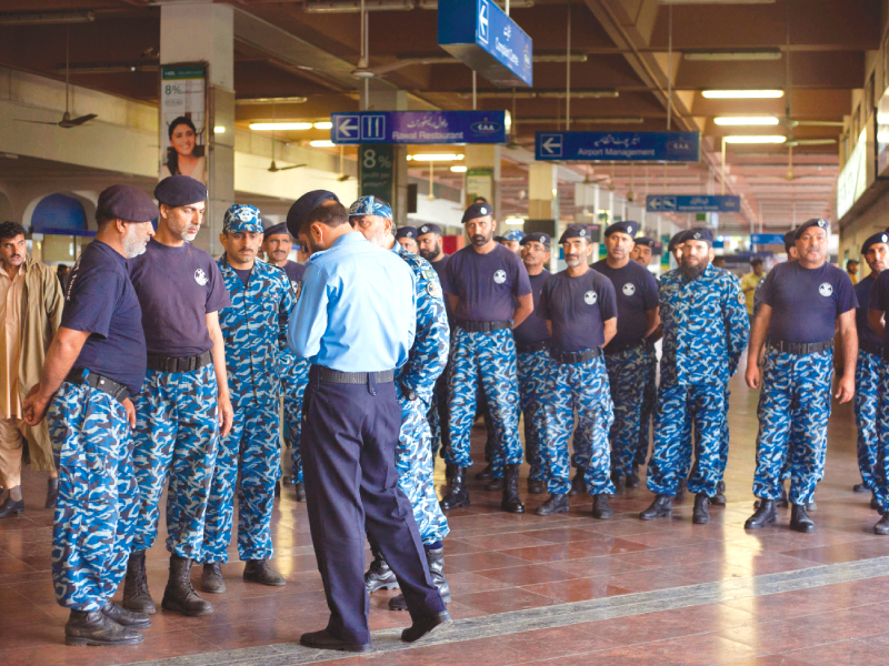 security personnel gather at the islamabad airport for the protection of former president pervez musharraf photo myra iqbal express