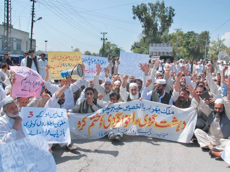 workers of the wapda hydro union protest outside the peshawar press club against tuesday s attack on sheikh muhammadi grid station and the abduction of four employees photo muhammad iqbal express