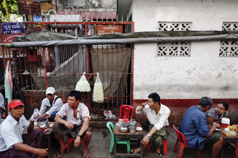 people sit at a tea shop near an islamic school where 13 boys were killed after a fire on tuesday in the central multi ethnic botataung district of the former capital yangon april 3 2013 photo reuters