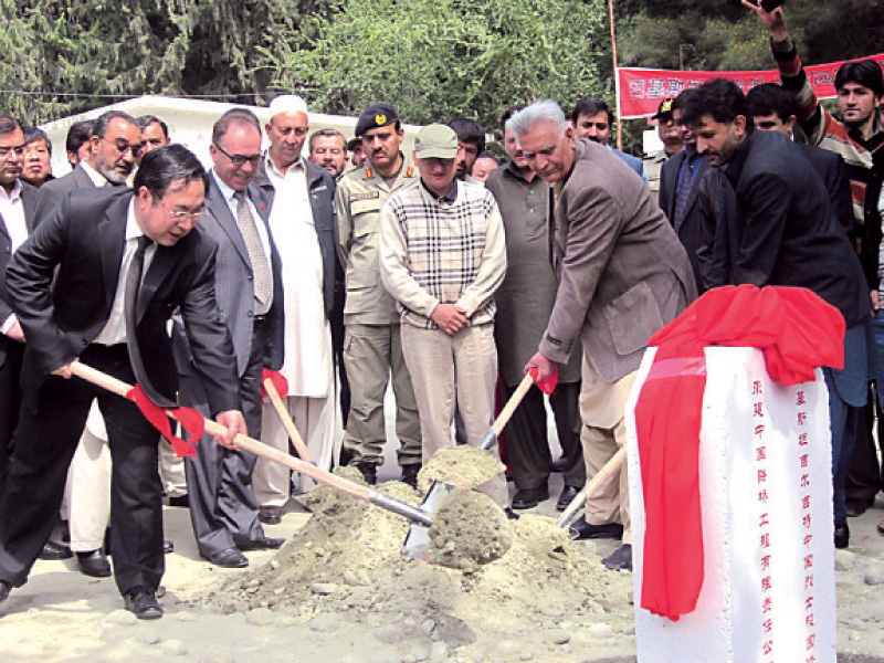officials lay the foundation stone at the ceremony the cemetery is located in danyor nearly 10 kilometres across gilgit river photo express
