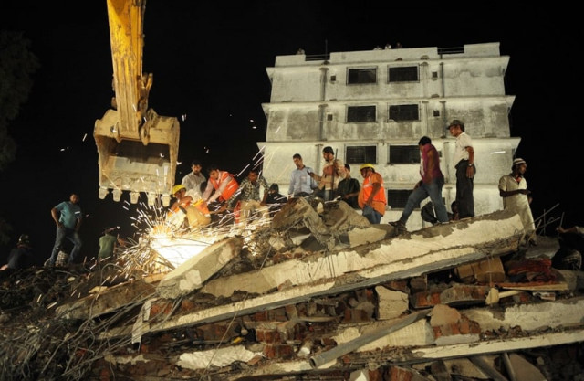 indian rescue workers cut metal rods as they look for survivors in the debris of a collapse building in mumbra on the outskirts of mumbai on april 4 2013 photo afp indian rescue workers cut metal rods as they look for survivors in the debris of a collapse building in mumbra on the outskirts of mumbai on april 4 2013 photo afp