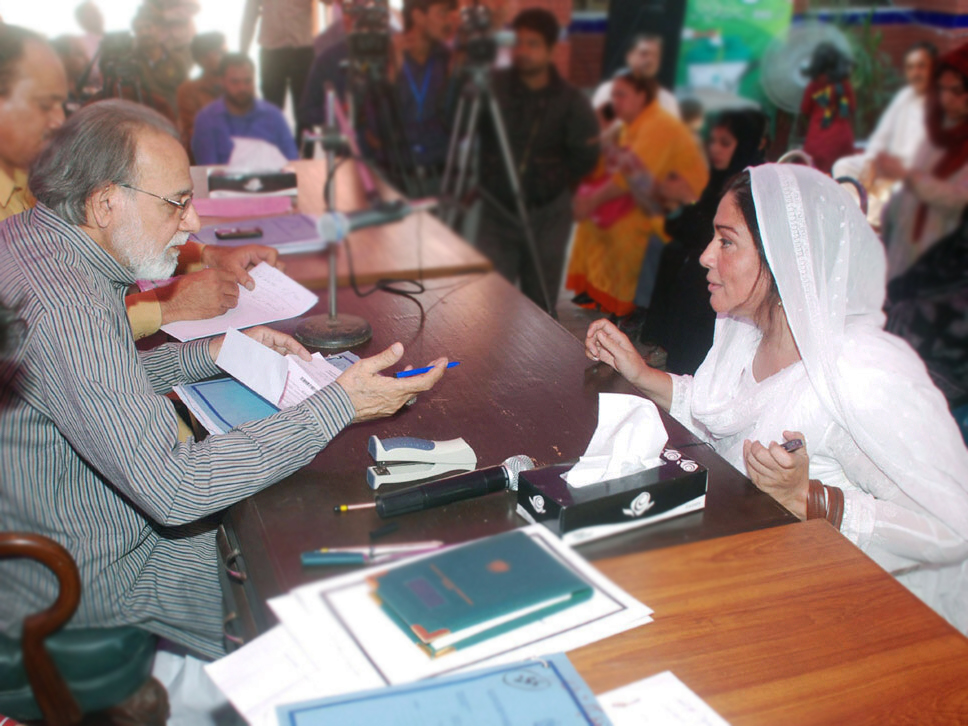 a returning officer scrutinises a candidate 039 s nomination papers photo nni file