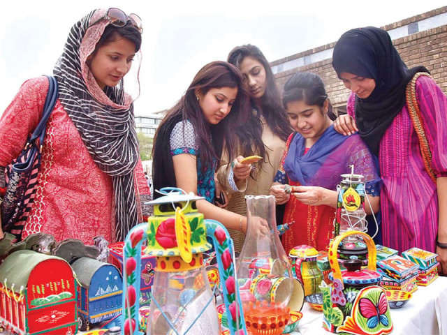 visitors take keen interest in items put on display at art bazaar photo app