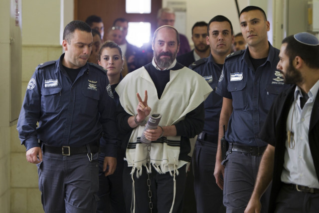 american born israeli settler yaakov jack teitel flashes the quot v quot for victory sign as he arrives for his trial at the jerusalem district court on april 9 2013 photo afp american born israeli settler yaakov jack teitel flashes the quot v quot for victory sign as he arrives for his trial at the jerusalem district court on april 9 2013 photo afp