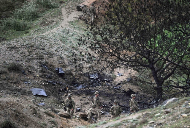 us soldiers are pictured at the scene of a helicopter crash during a recovery operation in the pachir wa agam district of nangarhar province on april 9 2013 photo afp us soldiers are pictured at the scene of a helicopter crash during a recovery operation in the pachir wa agam district of nangarhar province on april 9 2013 photo afp