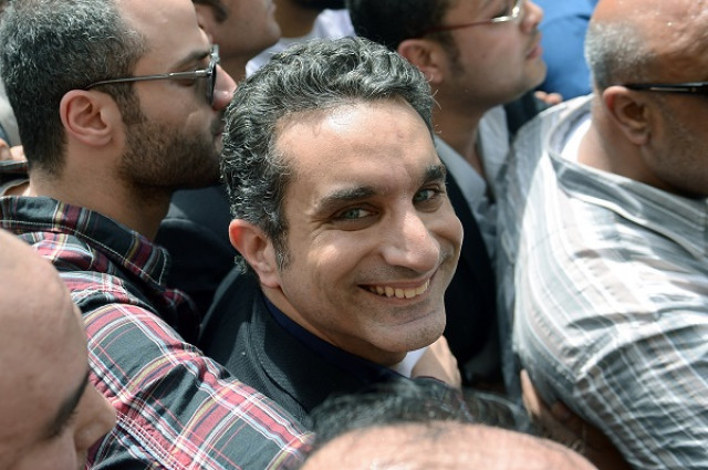 egyptian satirist and television host bassem youssef is surrounded by his supporters upon his arrival at the public prosecutor 039 s office in the high court in cairo on march 31 2013 photo afp egyptian satirist and television host bassem youssef is surrounded by his supporters upon his arrival at the public prosecutor 039 s office in the high court in cairo on march 31 2013 photo afp