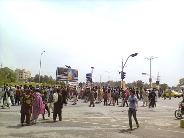 following the operation around 150 members of the affected families gathered at peshwar mor and blocked the main intersection for all kind of traffic photo the express following the operation around 150 members of the affected families gathered at peshwar mor and blocked the main intersection for all kind of traffic photo the express