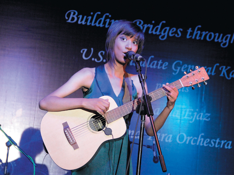 natasha ejaz sing their hearts out at a concert building bridges through music organised by the us consulate general at pak american cultural centre on monday photo ayesha mir express