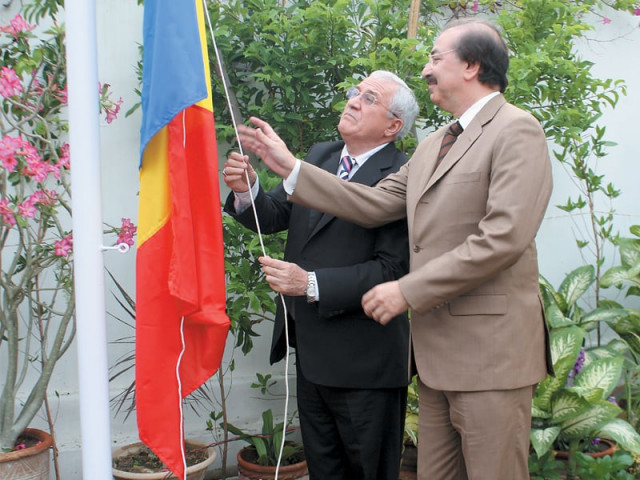 romanian ambassador emilian ion left and the new honorary consul of romania tariq saud right hoist the romanian flag at the reopening of the consulate in karachi on monday photo ameer hamza express romanian ambassador emilian ion left and the new honorary consul of romania tariq saud right hoist the romanian flag at the reopening of the consulate in karachi on monday photo ameer hamza express