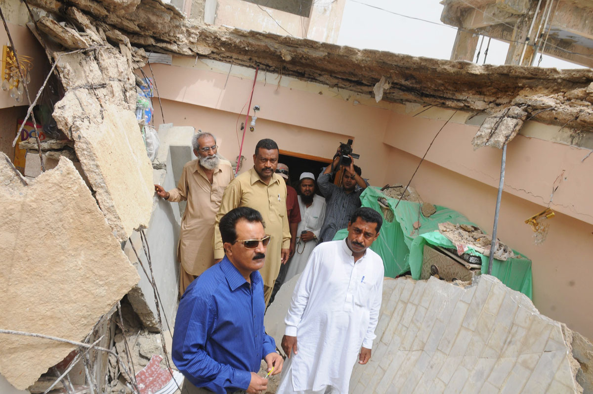 officials inspect the damage after the roof of a house collapsed killing three people photo mohammad saqib express