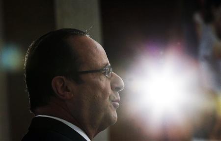 french president francois hollande delivers a speech during a ceremony for outgoing louvre museum director henri loyrette unseen at the louvre museum in paris april 9 2013 photo reuters