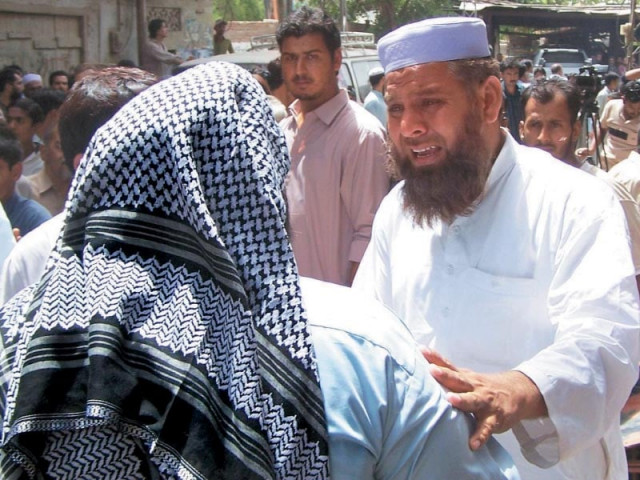 people mourn the killing of fakhrul islam who was a candidate for the mqm following an attack in hyderabad photo afp