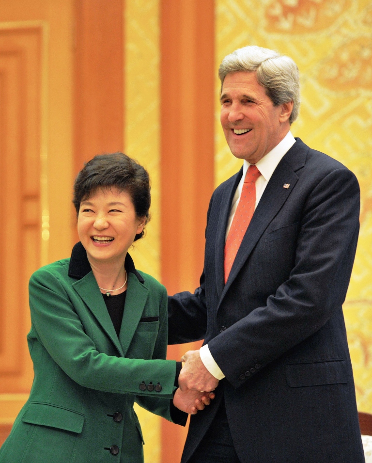 south korean president park geun hye l and us secretary of state john kerry r shake hands before their talks at the presidential blue house in seoul on april 12 2013 photo afp