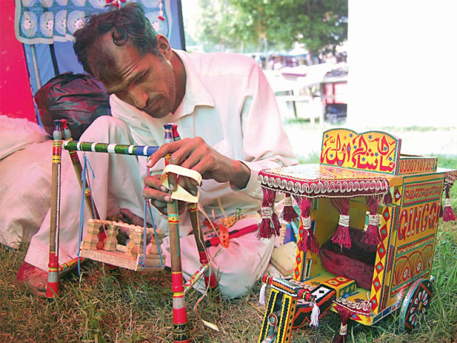 younas and his mother are depending on the festival to make money to finance the treated of his brother photo muhammad javaid younas and his mother are depending on the festival to make money to finance the treated of his brother photo muhammad javaid