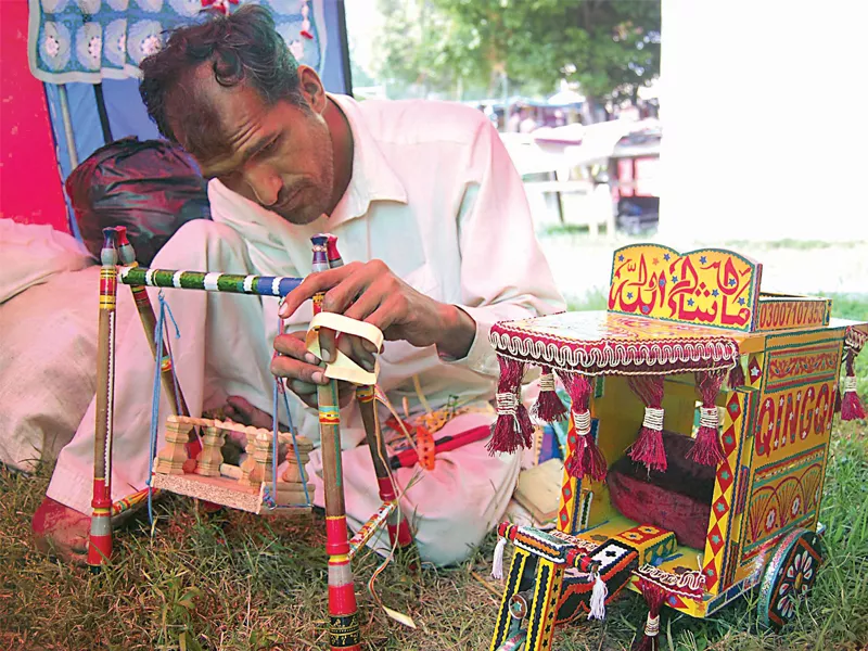 younas and his mother are depending on the festival to make money to finance the treated of his brother photo muhammad javaid younas and his mother are depending on the festival to make money to finance the treated of his brother photo muhammad javaid