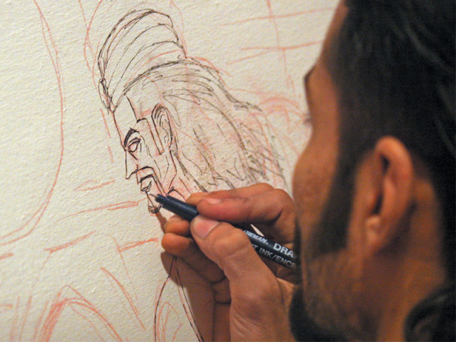 comic artist saad hassam drawing a sketch of umro ayar at the comic book s launch on sunday at t2f photo athar khan express comic artist saad hassam drawing a sketch of umro ayar at the comic book s launch on sunday at t2f photo athar khan express