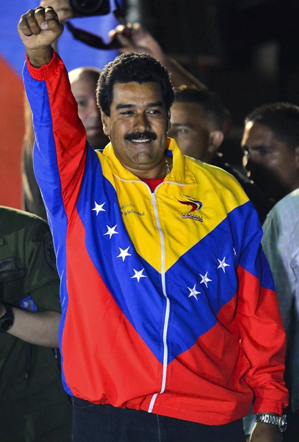 venezuelan elected president nicolas maduro celebrates following the election results in caracas on april 14 2013 photo afp luis acosta