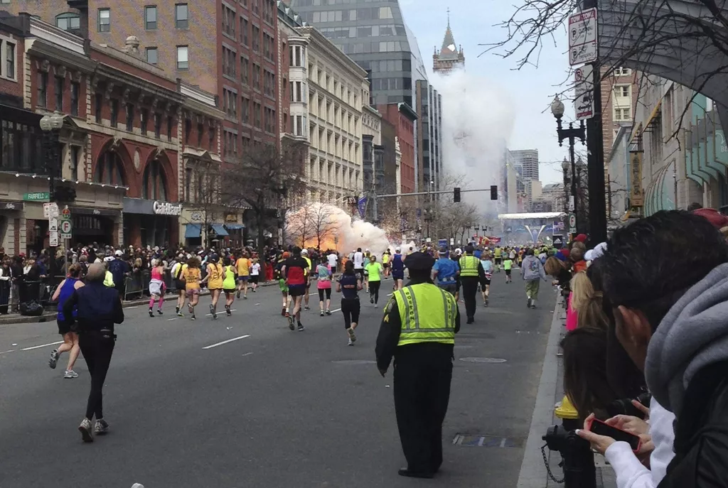 runners continue to run towards the finish line of the boston marathon as an explosion erupts near the finish line of the race in this photo photo reuters runners continue to run towards the finish line of the boston marathon as an explosion erupts near the finish line of the race in this photo photo reuters