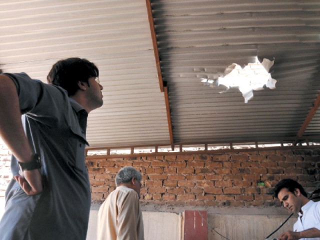 people inspect damages resulting from the attack on the house of pakistan peoples party s na 1 candidate zulfiqar afghani as the polls draw closer militants have increasingly targeted election candidates photo inp people inspect damages resulting from the attack on the house of pakistan peoples party s na 1 candidate zulfiqar afghani as the polls draw closer militants have increasingly targeted election candidates photo inp