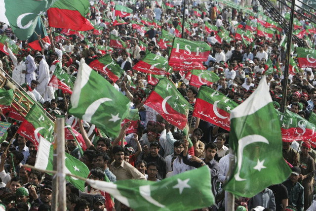 supporters of pakistan tehreek e insaf pti wave national and party flags during a rally in lahore march 23 2013 photo reuters supporters of pakistan tehreek e insaf pti wave national and party flags during a rally in lahore march 23 2013 photo reuters