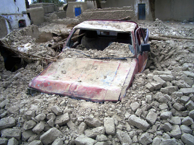 a destroyed car is seen in the rubble after an earthquake in the town of mashkeel balochistan near the iranian border april 17 2013 photo reuters a destroyed car is seen in the rubble after an earthquake in the town of mashkeel balochistan near the iranian border april 17 2013 photo reuters