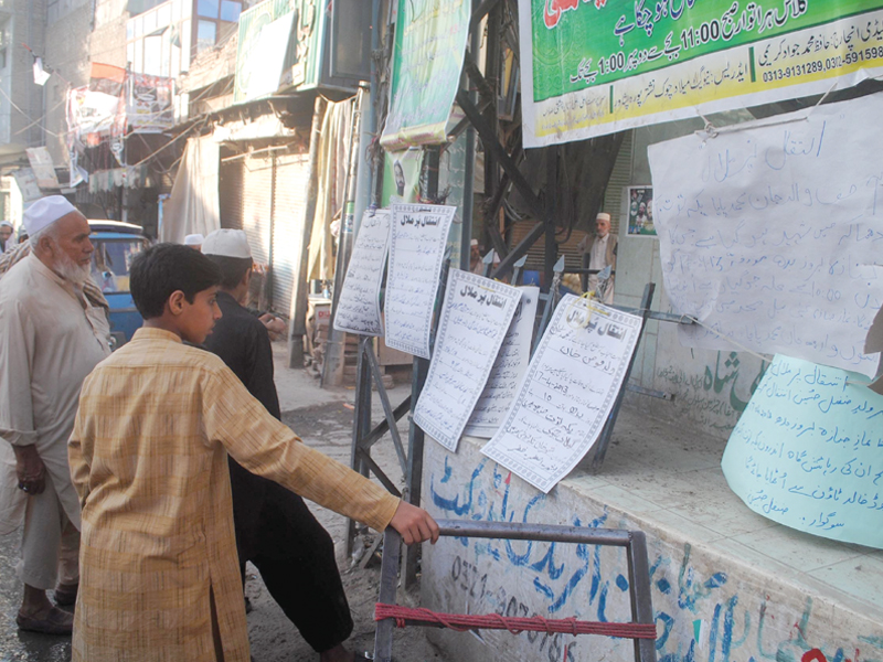 people read the details of the funerals at gillani chowk photo muhammad iqbal express