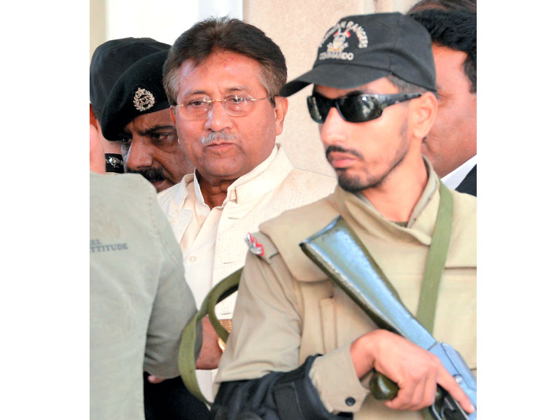 pervez musharraf is escorted by paramilitary soldiers outside the rawalpindi high court photo afp
