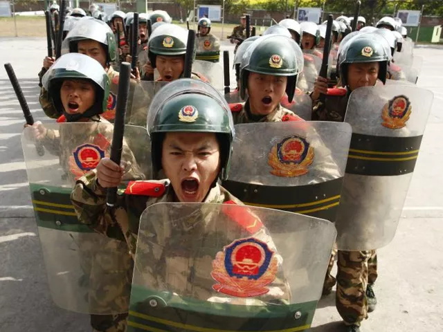 paramilitary policemen take part in anti riot training at a military base in suining sichuan province on mar 9 2010 photo reuters paramilitary policemen take part in anti riot training at a military base in suining sichuan province on mar 9 2010 photo reuters