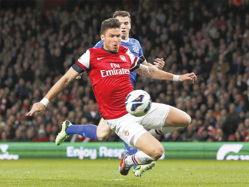 wenger is confident giroud will do a good job leading arsenal s attack next season photo reuters