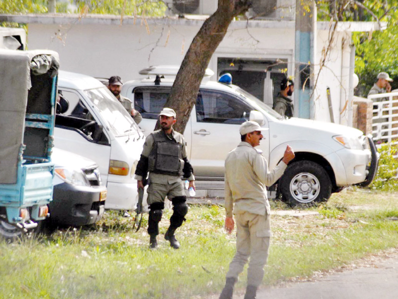 rangers personnel stand guard outside the police headquarters photo online