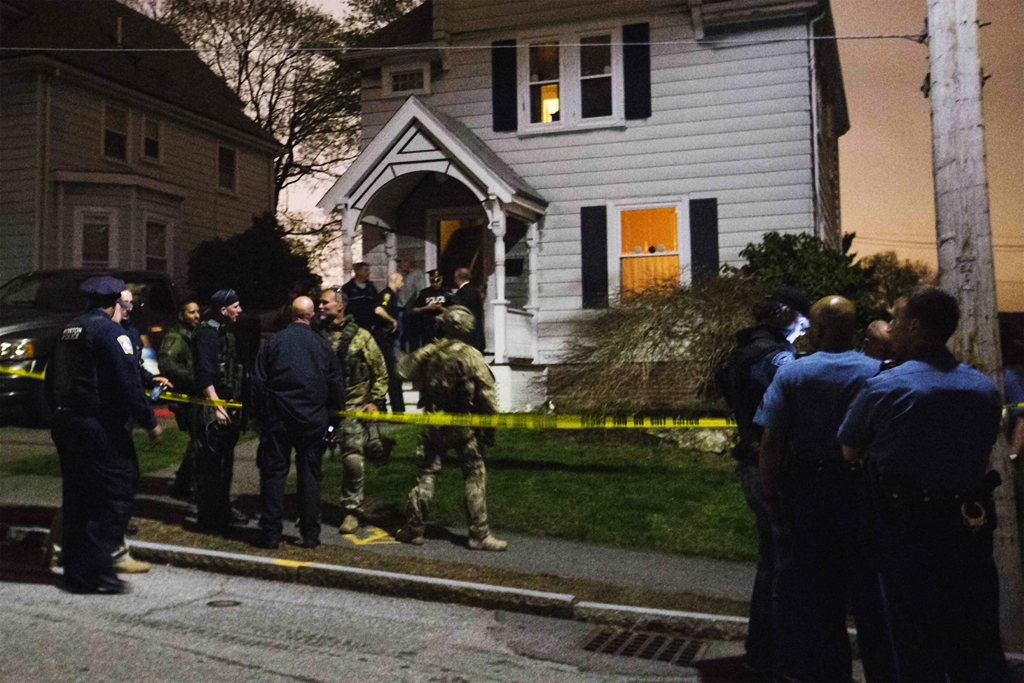 law enforcement officials are seen in front of 67 franklin st after the capture of dzhokhar tsarnaev the surviving suspect in the boston marathon bombings photo reuters